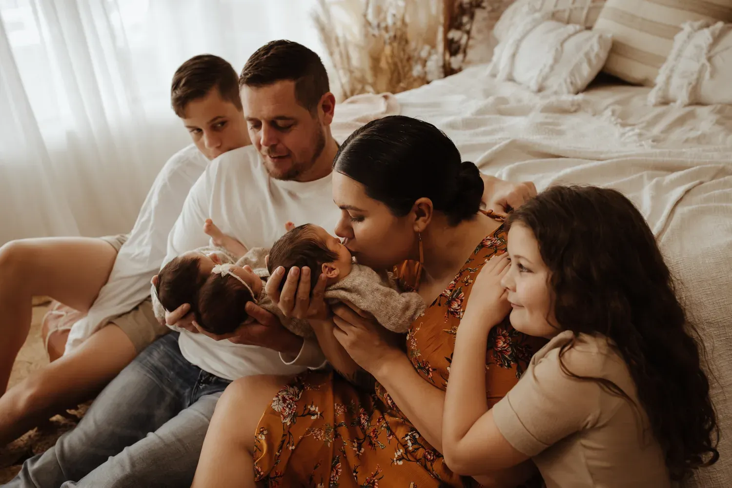 Lian Passmore with her family and newborn triplets